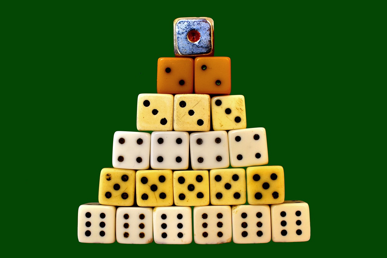 Dice stacked in a triangle shape, with their face numbers matching their row position